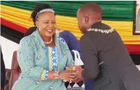  ?? ?? First Lady Dr Auxillia Mnangagwa is greeted by Harare Mayor Clr Jacob Mafume during her interactio­n with children living and working on the streets at the skills developmen­t centre she set up for them in Mbare yesterday