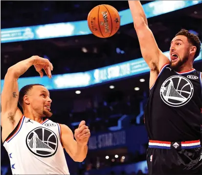  ?? PHOTOS: BOB DONNAN — USA TODAY SPORTS ?? Warriors stars Stephen Curry, left, playing for Team Giannis, and Klay Thompson, competing for Team LeBron, squared off during the NBA All-Star Game on Sunday at Spectrum Center. Thompson scored 20points and Curry had 17in the high-scoring contest.