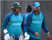  ?? AFP ?? Australian batsman Usman Khawaja, left, alongside Nathan Lyon in the nets in Melbourne