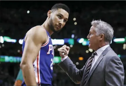 ?? CHARLES KRUPA — THE ASSOCIATED PRESS ?? Philadelph­ia 76ers coach Brett Brown, right, talks with guard Ben Simmons before Game 5 of their second-round playoff series against the Boston Celtics last season. Brown said Tuesday that Simmons and Markelle Fultz have both committed to working on their shooting skills this offseason.
