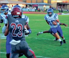  ?? FRANK CROWE / For the Calhoun Times ?? Gordon Central’s Brent Silvar (15) looks to turn the corner past the Southeast Whitfield defense during the first half on Friday.