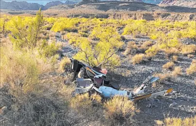  ?? Nevada Highway Patrol ?? Debris from a helicopter crash is seen Wednesday afternoon in Red Rock Canyon National Conservati­on Area. The pilot later died.
