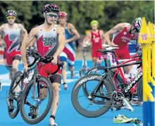  ?? THE CANADIAN PRESS FILES ?? Canada’s Brent McMahon runs from the transition zone as he races in the men’s triathlon at Hyde Park during the London Summer Olympics in 2012.