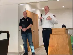  ?? JOHN BUTLER — THE NEWS-HERALD ?? Lt. Jason Buss of Richmond Heights Fire Department is presented the Employee of the Year award from Fire Chief Marc Neumann.