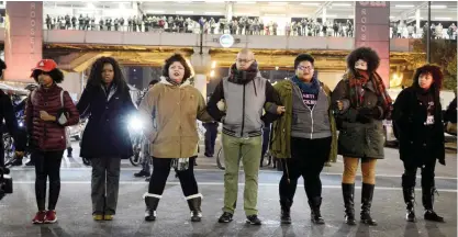  ??  ?? CHICAGO: Protesters shut down a street during a protest for 17-year-old Laquan McDonald early yesterday.