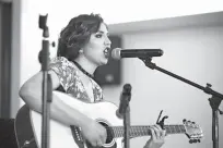  ?? Staff photo by Joshua Boucher ?? Laura Lee Bishop, a former American Idol contestant from Gilmer, Texas, performs before Beto O’Rourke takes the stage at the Twin City Event and Conference Center.