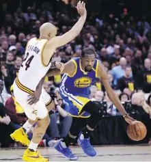  ??  ?? Warriors’ Kevin Durant, right, drives on Cavaliers’ Richard Jefferson during the first half of Game 3 of the NBA Finals in Cleveland.