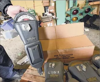  ?? Lori Van Buren / Times Union ?? An auction of four dozen coin-operated Troy parking meters, last used in the 1980s, brought in about $1,300, or about $27 apiece.