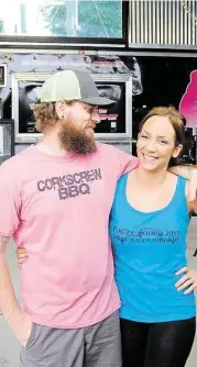  ?? David Hopper Will and Nichole Buckman stand in the dining area of Corkscrew BBQ at 24930 Budde Road. ??