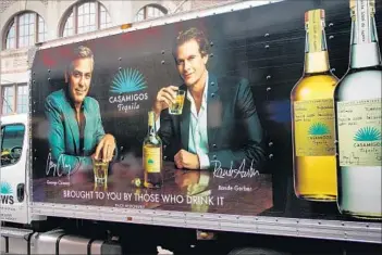  ?? George Rose Getty Images ?? GEORGE CLOONEY and friend Rande Gerber are two of the three partners who own Casamigos. Diageo agreed to pay $700 million for the firm, and $300 million more if certain performanc­e goals are met.