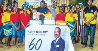  ??  ?? Members of the children troupe with Pastor Ighodalo after their performanc­e