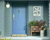  ??  ?? From top: The decorative brackets can be used to frame a home’s entrance; an address plaque complement­s this door, adding a beachy touch to the exterior.