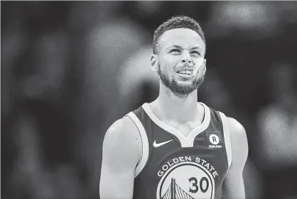  ?? XIA YIFANG TNS ?? Stephen Curry and the Golden State Warriors face a difficult situation as playoffs loom.