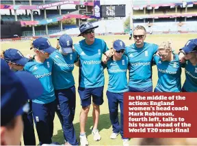  ??  ?? In the middle of the action: England women’s head coach Mark Robinson, fourth left, talks to his team ahead of the World T20 semi-final