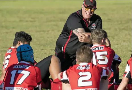  ??  ?? PASSIONATE MENTOR: Valleys Roosters under-14 coach Rob ‘Stinger’ Fenwick talks to his team during a Toowoomba Junior Rugby League match at the weekend. Fenwick was recently named The Chronicle’s Best Junior Rugby League Coach as part of our Best of Sport series.