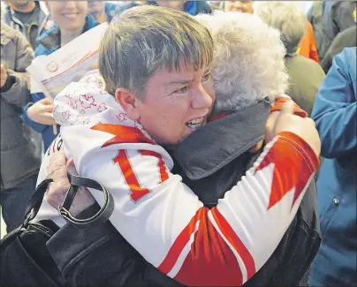  ?? DAVID JALA/CAPE BRETON POST ?? Double-medallist Aimee Gordon, of Sydney Mines, received a big hug from her aunt Ada Gordon upon her return from the Special Olympics World Winter Games in Austria, where the speedskate­r won a gold medal in the 500-metre race and a bronze medal in the...