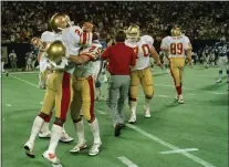  ?? MARIO SURIANI, FILE — THE ASSOCIATED PRESS ?? Philadelph­ia/Baltimore Stars’ Scott Woerner, left, hugs teammate Bill Hardee after winning the USFL Championsh­ip in 1985. This week, the new iteration of the Philadelph­ia Stars will play for the USFL title, the fourth time over five decades a Philadelph­ia team has made the league final.