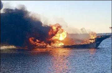  ?? AP ?? Flames engulf a boat in the Tampa Bay area on Sunday.
