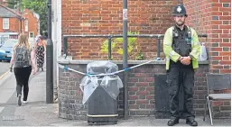  ?? Picture: PA. ?? A police officer stands by a sealed-off litter bin on Rollestone Street, Salisbury, Wiltshire.