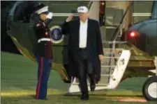  ?? AP PHOTO/ANDREW HARNIK ?? President Donald Trump steps off Marine One on the South Lawn at the White House in Washington, Sunday after returning from Camp David.