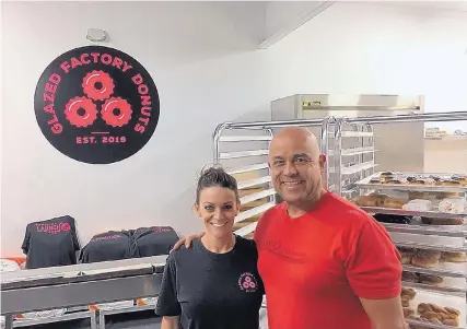  ?? STEPHEN HAMWAY/JOURNAL ?? Natalie Palmer and Bennie Martinez, co-owners of Glazed Factory Donuts, show off their commissary kitchen on Pan American Freeway NE. Glazed Factory offers 50 varieties of doughnuts for order online, over the phone and at its food truck.