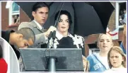  ??  ?? UNDER COVER: Matt Fiddes shelters Michael Jackson from the sun