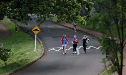  ?? Photograph: Phil Walter/Getty Images ?? People exercise in Cornwall Park, Auckland, New Zealand. Nine weeks into lockdown and Leni Ma’ia’i wants to be sure others are obeying the level-3 rules.