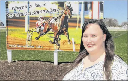  ?? SUBMITTED PHOTO ?? Daphne Cooper is shown at Truro Raceway’s centre field in front of world champion somebeachs­omewhere sign.