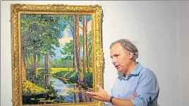  ??  ?? Jean Paul Engelen, deputy chairman and worldwide co-head of 20th century and contempora­ry art at Phillips Auction House beside The Moat, Breccles painting made by Winston Churchill.