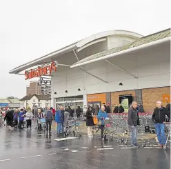  ?? Picture: BBC ?? Shopping to buy essential supplies is one of the few things which are permitted as Britain ramped up its response to the coronaviru­s outbreak. Right: Prime Minister, Boris Johnson, addresses the nation on Monday