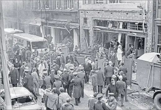  ??  ?? Emergency crews help survivors in the rubble after the no-warning car bomb in Lower Donegall Street in Belfast in March, 1972Victor Patterson