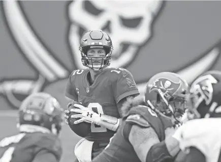  ?? KIM KLEMENT/USA TODAY SPORTS ?? Buccaneers quarterbac­k Tom Brady drops back to pass against the Falcons on Jan. 3 in Tampa, Fla. Tampa Bay can become the first team to host the Super Bowl if they win the NFC title game.