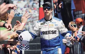  ?? Steve Helber / Associated Press ?? Brad Keselowski greets fans during introducti­ons prior to the NASCAR Cup Series auto race at the Martinsvil­le Speedway in Martinsvil­le, Va., in 2019.