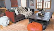  ?? DESIGN RECIPES ?? Charcoal walls and a blend of ruby red, forest green and dark brown make this living room feel warm, rich and cozy.