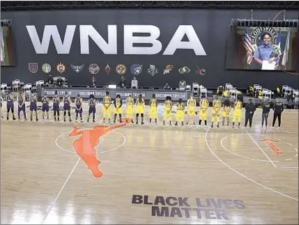  ?? Phelan M. Ebenhack Associated Press ?? PLAYERS FROM the Mercury and Sparks in a moment of silence for Breonna Taylor in July, when the WNBA began its seasonlong dedication to her. The league has been a step ahead of other sports on social justice issues but doesn’t get as much attention.