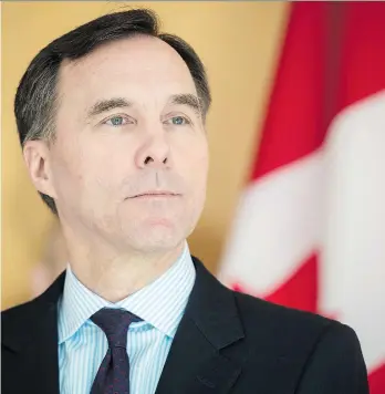  ?? TIJANA MARTIN/THE ASSOCIATED PRESS ?? Finance Minister Bill Morneau has ignored warnings by some observers against indulging in higher spending when the economy is robust. The Liberals have routinely run deficits.