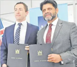  ?? Picture: ATU RASEA ?? ADB’s Pacific Subregiona­l office in Fiji Regional director Aaron Batten with the Attorney-General Aiyaz Sayed-Khaiyum after the signing yesterday.