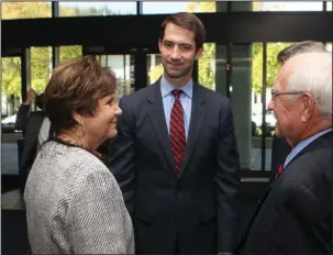  ?? The Sentinel-Record/Richard Rasmussen ?? PROUD PARENTS: Adam Brown’s parents, Janice Brown, left, and Larry Brown, far right, talk with U.S. Sen. Tom Cotton, R-Ark., Monday at the Hot Springs Convention Center prior to a ceremony to rename the downtown post office for their son, who was...