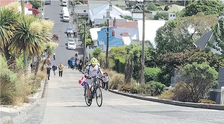  ?? — RUDY POSPISIL ?? Going up. Burnaby firefighte­r Rudy Pospisil set a world record after pedalling up Baldwin Street in Dunedin, New Zealand in three minutes and 49.25 seconds.