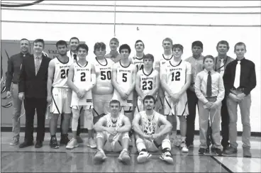  ?? Barb McIntosh ?? The Mullen boys basketball team pose for a photo after defeating Hay Springs 67-29 in the D2-1 District Final at Valentine on Feb. 27. The Broncos are the second seed in the State Tournament and will play Osceola in the first round. Pictured in their white uniforms are front row left to right: Brendon Walker, and Bryce McIntosh. Second Row: Samuel Coble, Trevor Kuncl, Cade Groseth, Luke Durfee, Kyle Finney, and Ethan Hardin. Third Row: Jaden Emerson and Clayron Moore along with the rest of the coaches and managers for the Broncos.