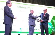  ??  ?? ISSASS Malaysia president Prof Dr Abdul Shukor Juraimi (right) presents a souvenir to Uggah.