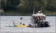  ?? MARK R. RUMMEL — THE TIMES HERALD VIA AP ?? A Customs and Border Protection boat helps floaters during Float Down on Sunday. The winds blew most boaters toward the Canada shore and they had to be pulled back to the U.S.