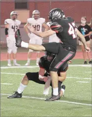  ??  ?? Blackhawk senior Colin Stewart (No. 42) kicks for the extra point, in Blackhawk Stadium.