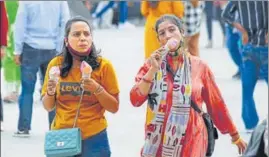  ?? DEEPAK SANSTA/HT ?? Tourists take a stroll on a hot sunny day on The Ridge in Shimla on Saturday.