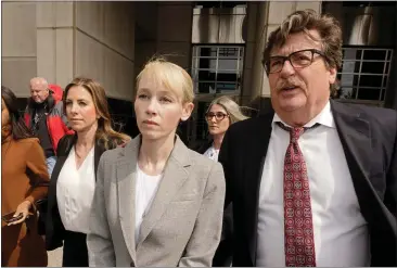 ?? PHOTOS BY RICH PEDRONCELL­I — ASSOCIATED PRESS FILE ?? Sherri Papini of Redding leaves the federal courthouse accompanie­d by her attorney, William Portanova, right, in Sacramento.