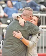  ?? ♦ Steven Eckhoff ?? Former Model assistant and current Coosa coach Robby Dooley (left) shares a hug with longtime Model coach Sally Echols after Monday’s game in the Region 7-AA tournament at Chattooga.
