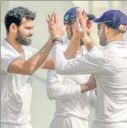  ?? PTI ?? Vidarbha’s Aditya Sarwate (left) dismissed Cheteshwar Pujara twice. He has taken eight wickets so far in the Ranji final.