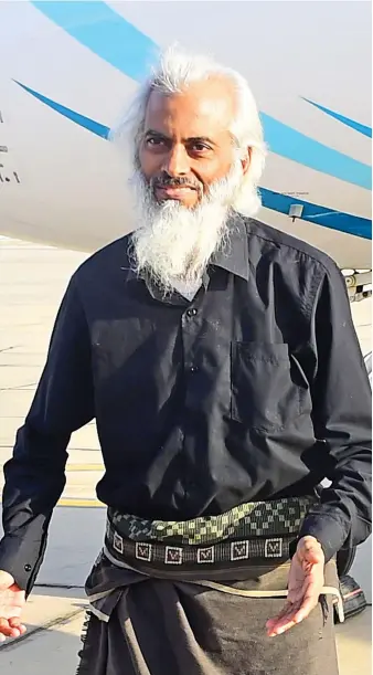  ?? EPA ?? Father Tom Uzhunnalil, the Indian priest who was kidnapped from an old people’s home in Yemen, leaves an Omani air force plane in Muscat after he was freed