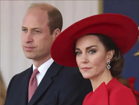  ?? Chris Jackson/Associated Press ?? Britain’s Prince William, first in line to become the British king, and his wife, Kate, Princess of Wales, attend a ceremonial welcome for the president and first lady of the Republic of Korea at Horse Guards Parade in London in November. King Charles’ cancer diagnosis comes at an awkward time, as Kate, his daughter-in-law, also has had health issues. She recently was hospitaliz­ed for two weeks following abdominal surgery at a private clinic in London.