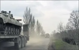  ?? BRENDAN HOFFMAN — THE NEW YORK TIMES ?? A Ukrainian Army convoy near Khlibodari­vka in eastern Ukraine is seen earlier this week.